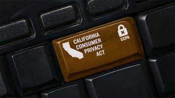 An image featuring a keyboard that has a custom made brown button that has the California consumer privacy act text
